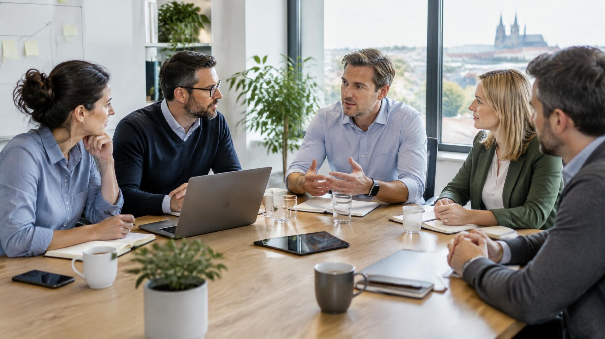 Team having a focused business discussion around a table