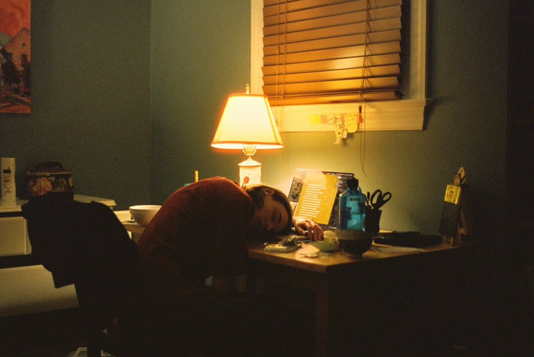 person reflecting at desk